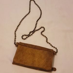 Free people durt brown distressed leather crossbody bag.